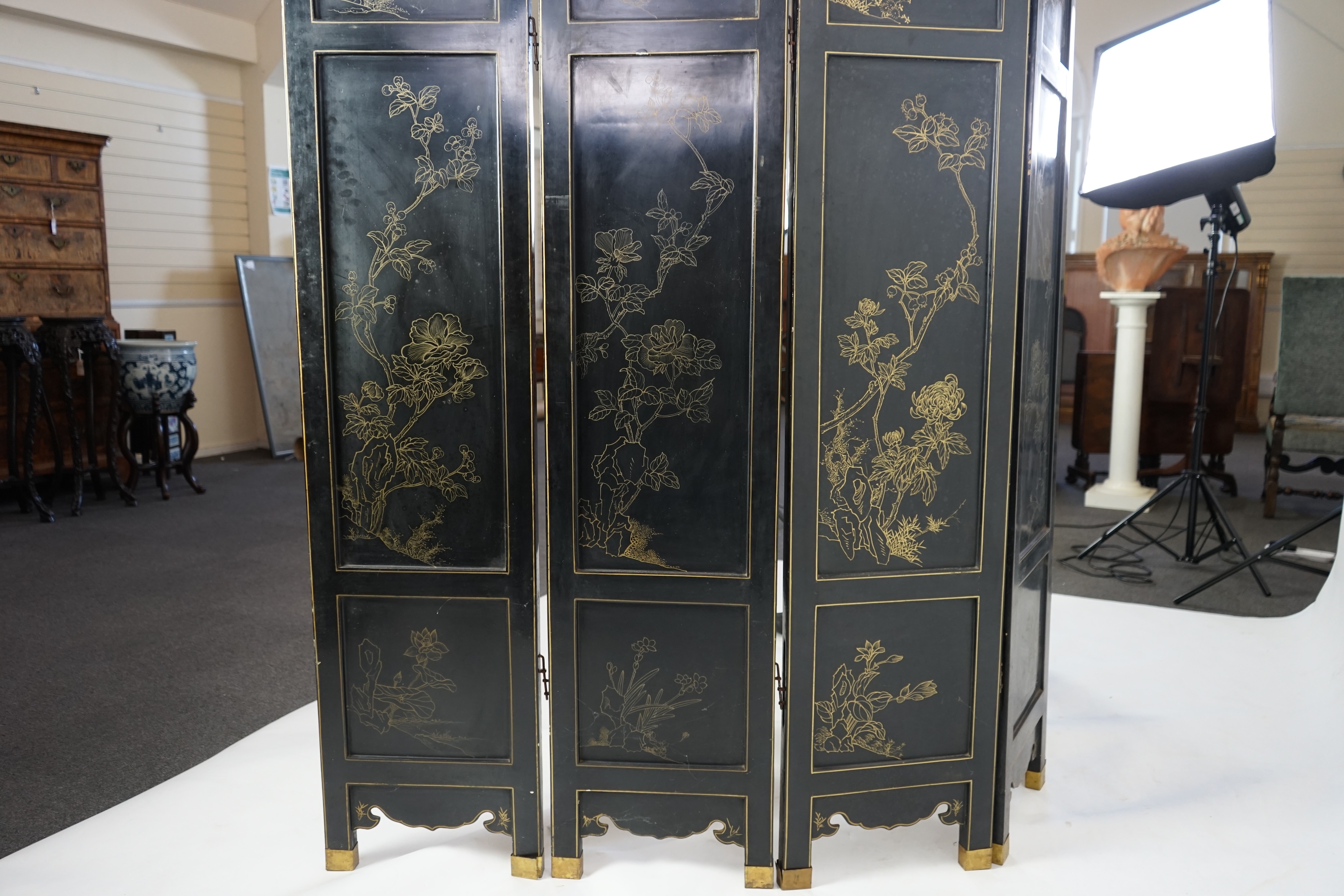 A Chinese tixi lacquer and carved soapstone overlaid six panel screen, mid 20th century